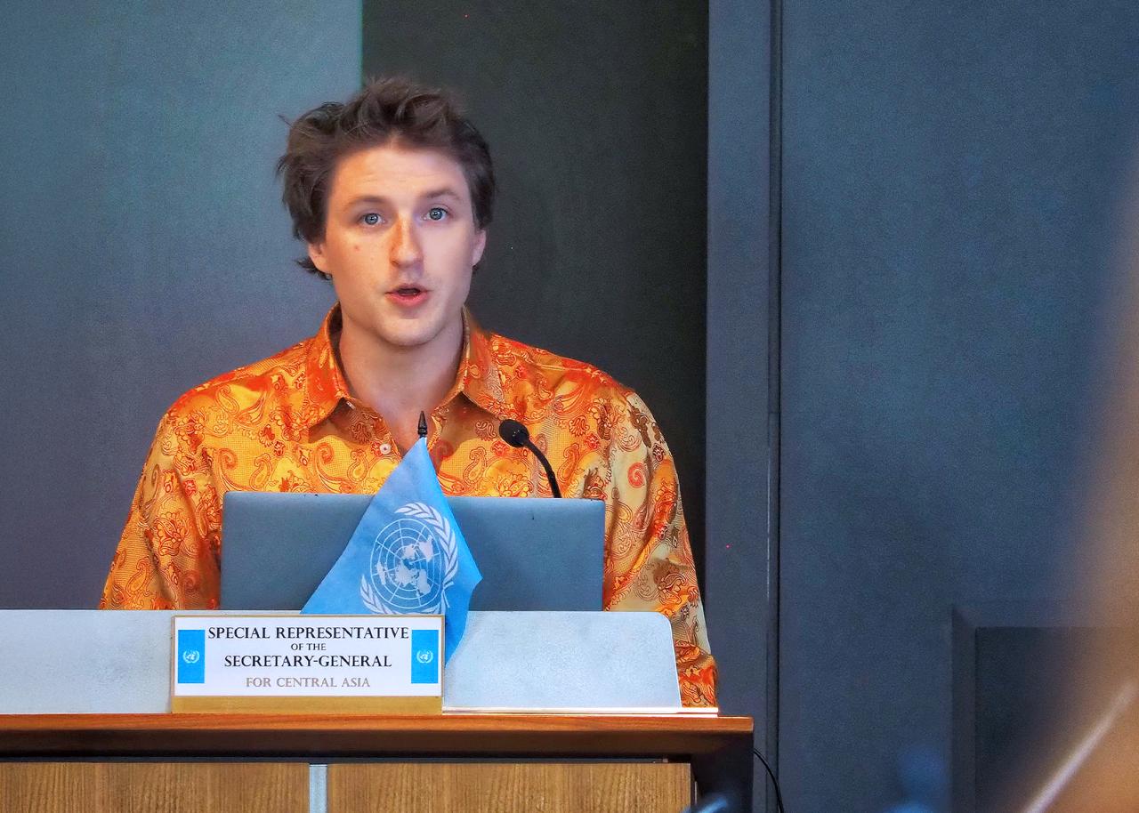 Student speakng at a podium.