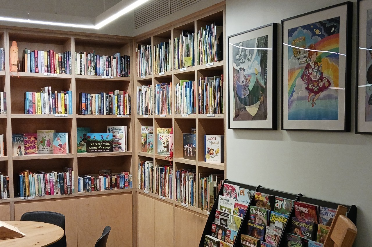 In the Scholastic offices in NYC, there is a whimsical room with hundreds of childrens books on shelves intersecting in a corner