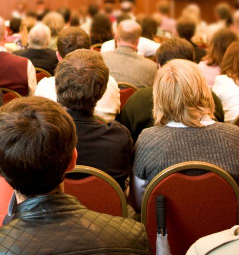 Engaged members of an audience listen to a programming at an NYU SPS event.
