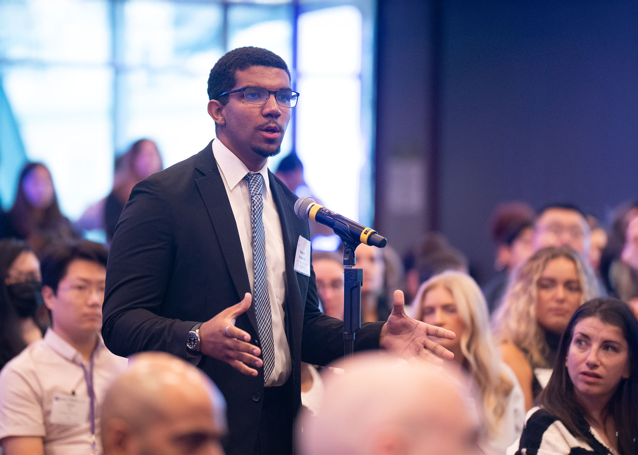 NYU SPS Hospitality Speaker in front of crowd.