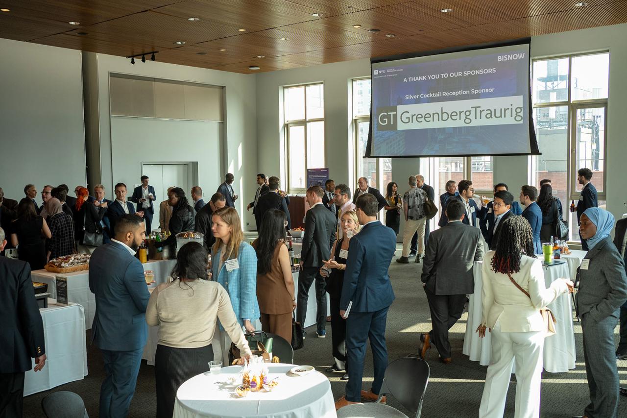 Carreer fair, big screen shows GreenbergTraurig