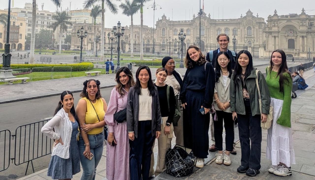Group photo of students in front of ornate building