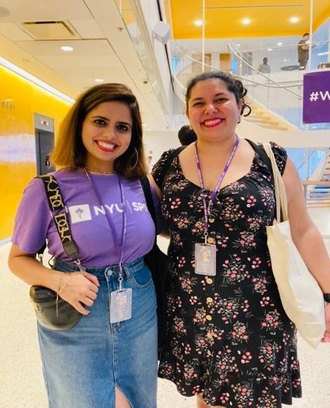 Students smile for a photo in the lobby of NYU SPS on E. 12th Street.