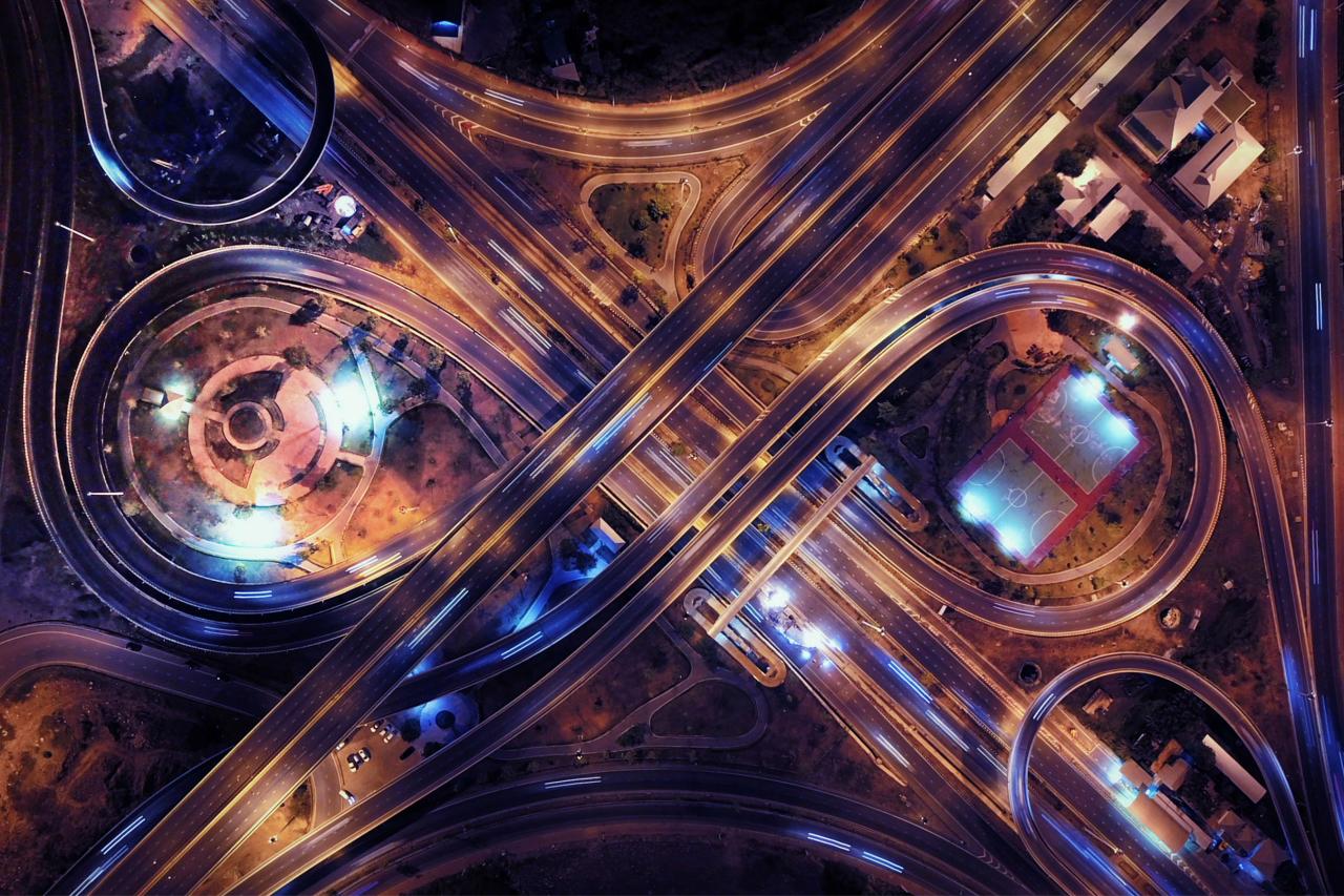 Aerial overview of Shanghai city lights and moving traffic.