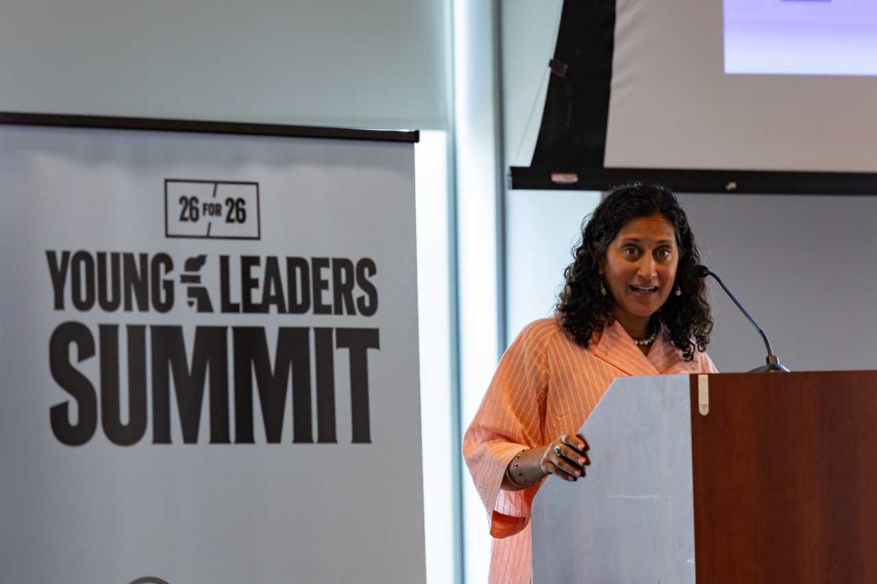 NYU SPS Dean Angie Kamath welcomes attendees to the Youth Leaders Summit and Youth Innovation and Sport Day at NYU. 