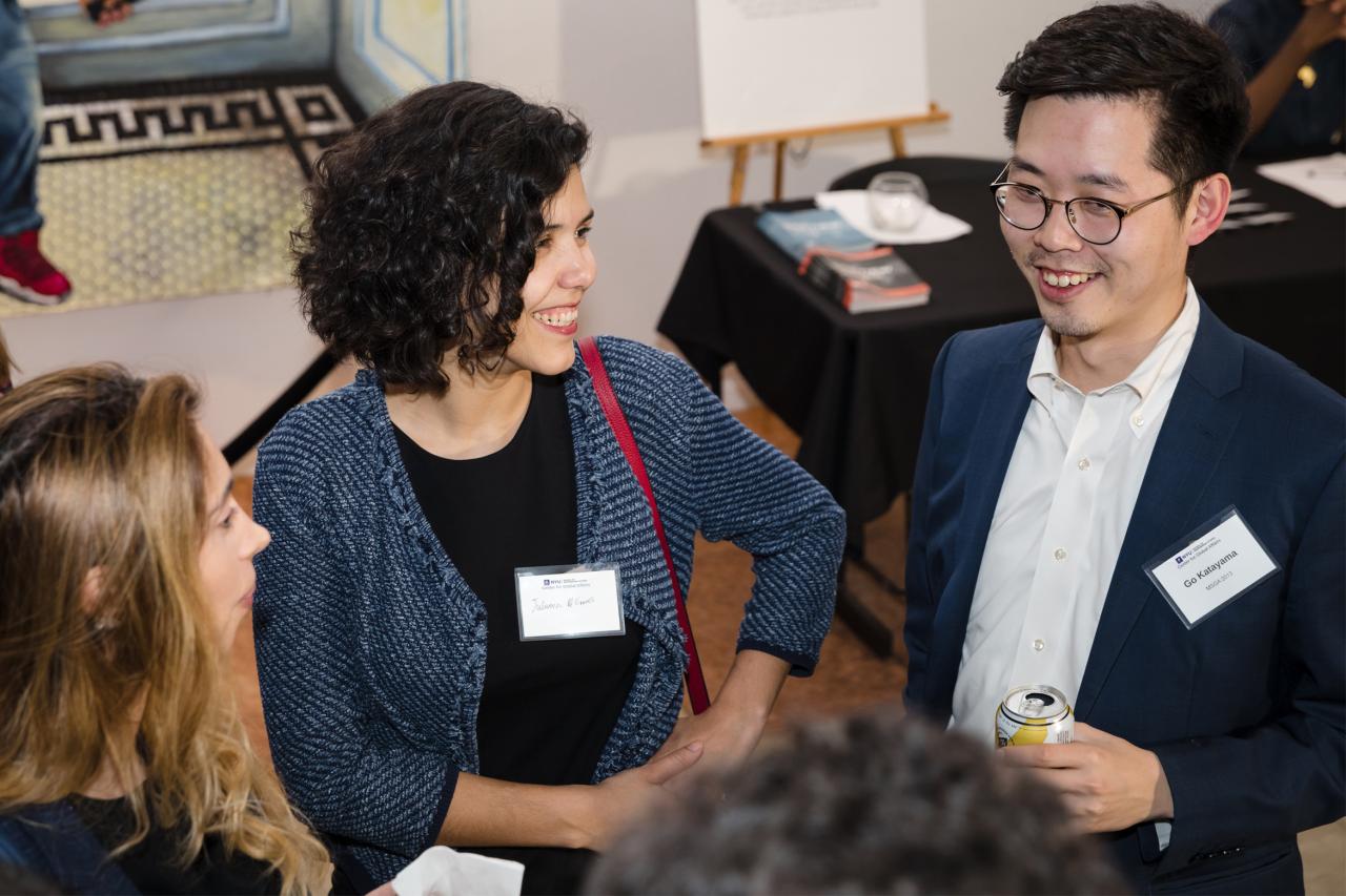 Three NYU SPS Class of 2024 alumni gather at an event