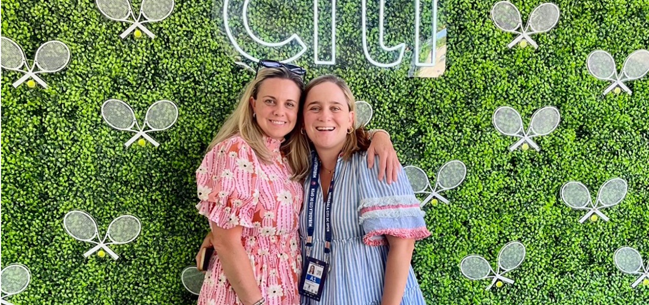 Caroline Kasper, NYU SPS Preston Robert Tisch Institute for Global Sport alumnus, poses with a friend at a tennis-themed Selfie Station sponsored by Citi.