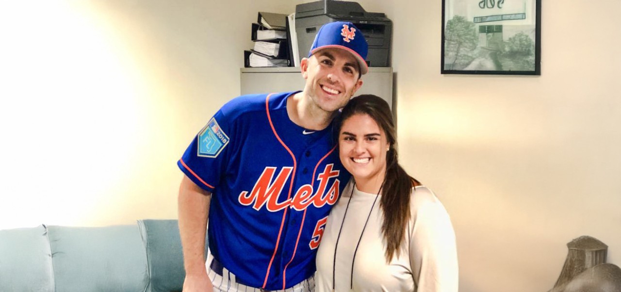 Reno Rismondo, Preston Robert Tisch Institute for Global Sport at NYU SPS alumnus, poses for a photo with a member of the New York Mets.