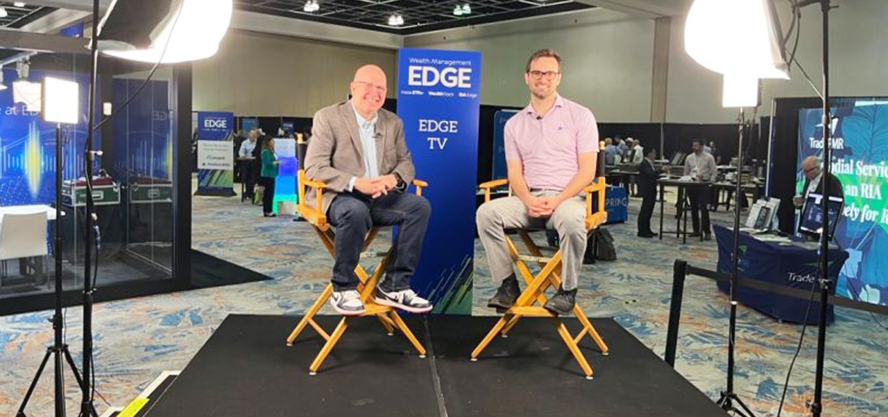 Colin Slabach sits in a chair on the set of EDGE TV before an appearance on the show