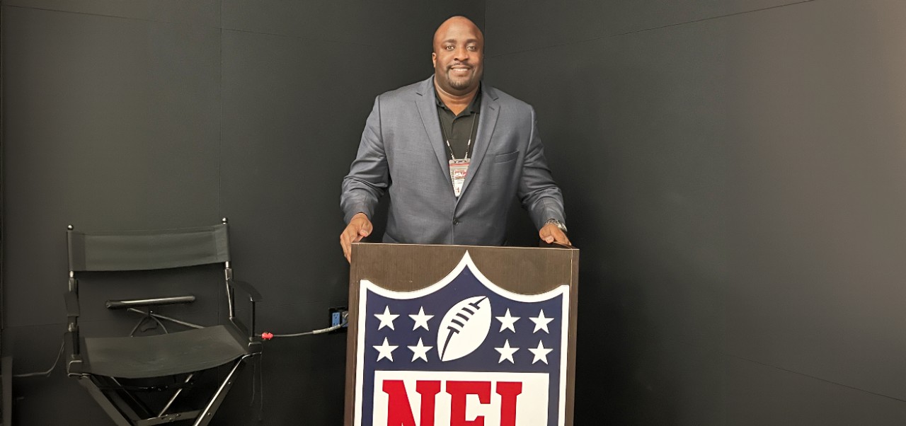 Daniel G Kelly II, Clinical Professor, Preston Robert Tisch Institute for Global Sport, NYU SPS, stands at an NFL-branded lectern.
