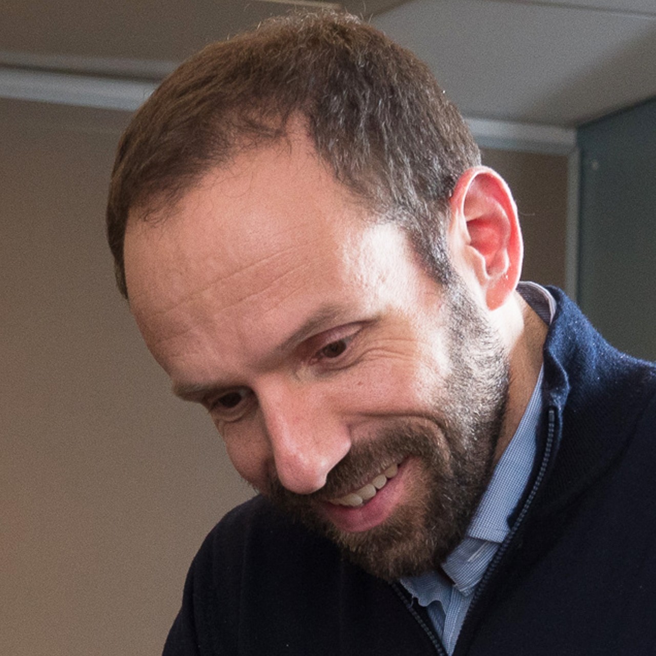 Headshot of Lee Igel smiling in professional attire.