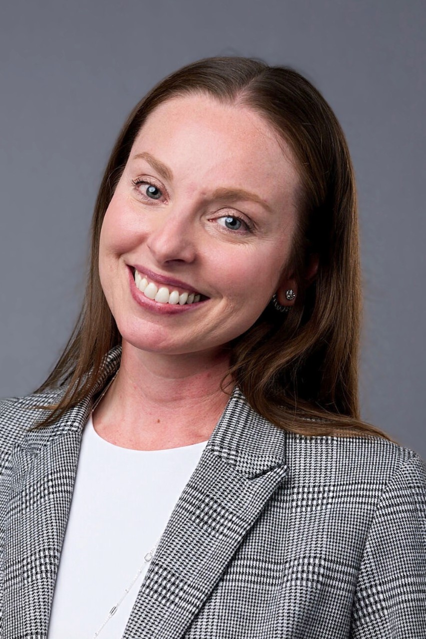 Smiling headshot of Sabrina Corrozza in a blazer