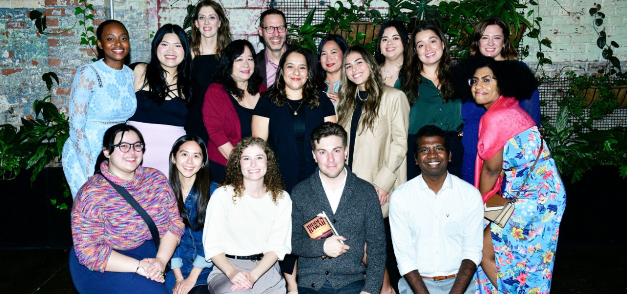 Aananth Dasknamurthy, student at the Center for Publishing and Liberal Arts, NYU SPS, poses for a group photo with a large cohort of students.