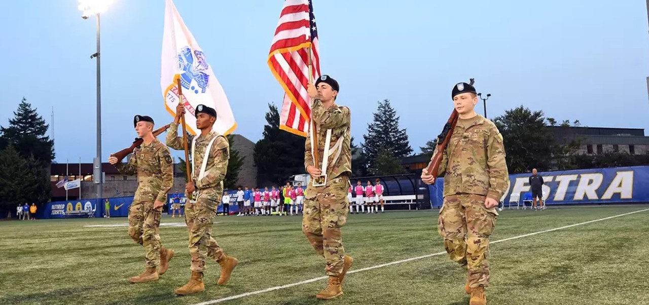 Maurice Moore, student at the NYU SPS Division of Applied Undergraduate Studies, pictured with colleagues in the armed forces.