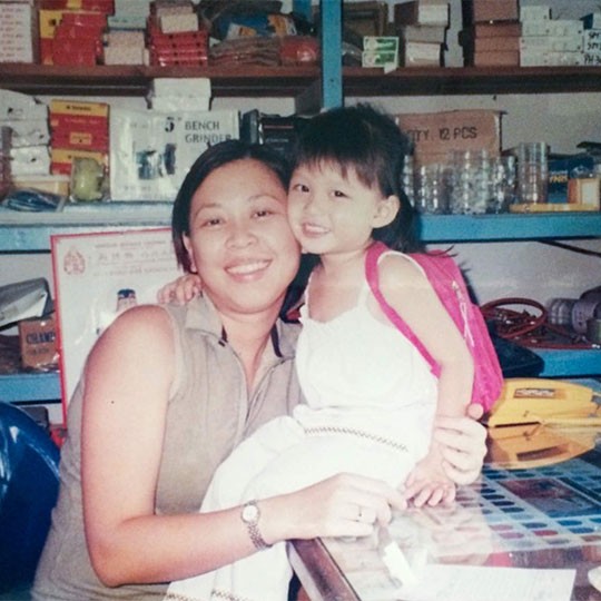 A childhood photo of Natasya Maurren Tan with a relative.