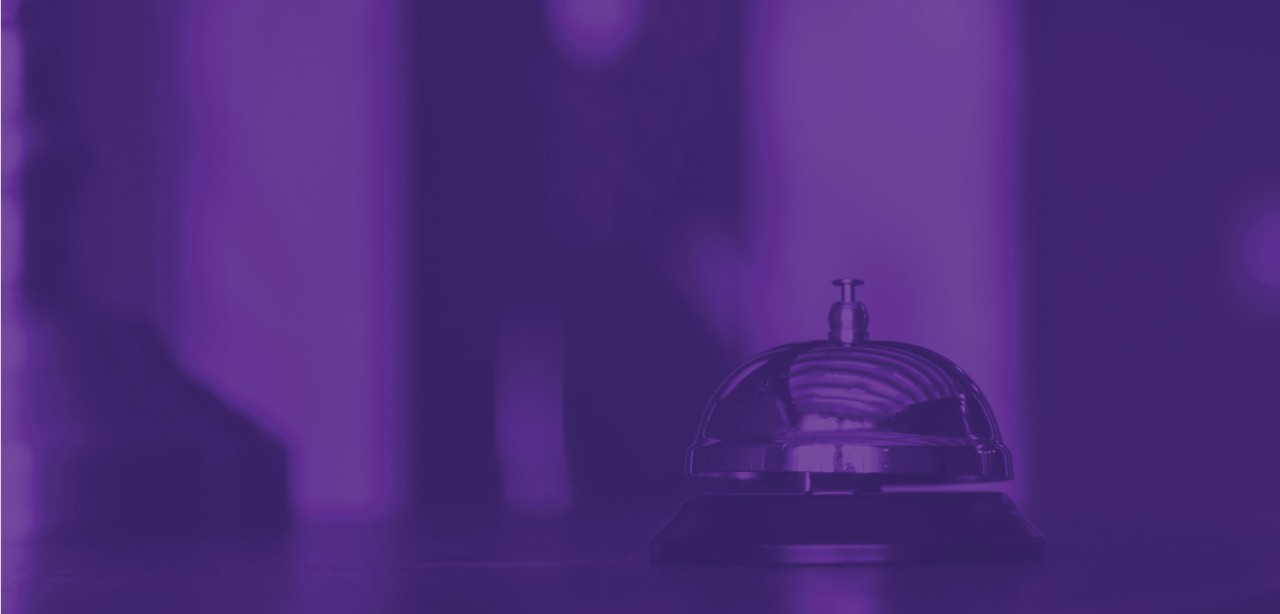 A woman smiles at the camera while standing in front of the Westin Hotel in Union Square, Manhattan.