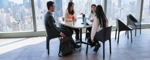 students in a business meeting