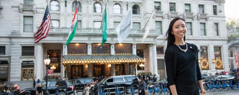 nyu student in front of a hotel