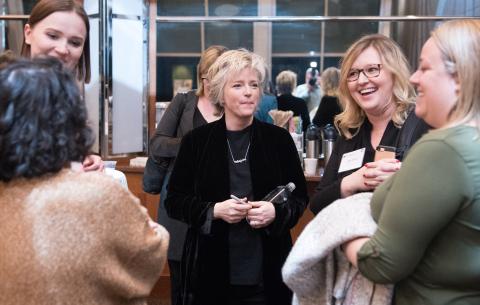 nyu students networking at an event
