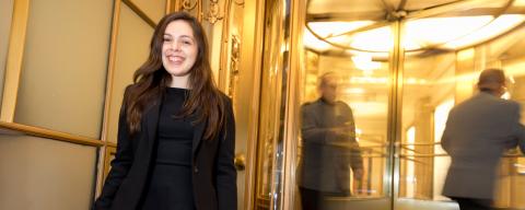 nyu student inside a hotel entrance