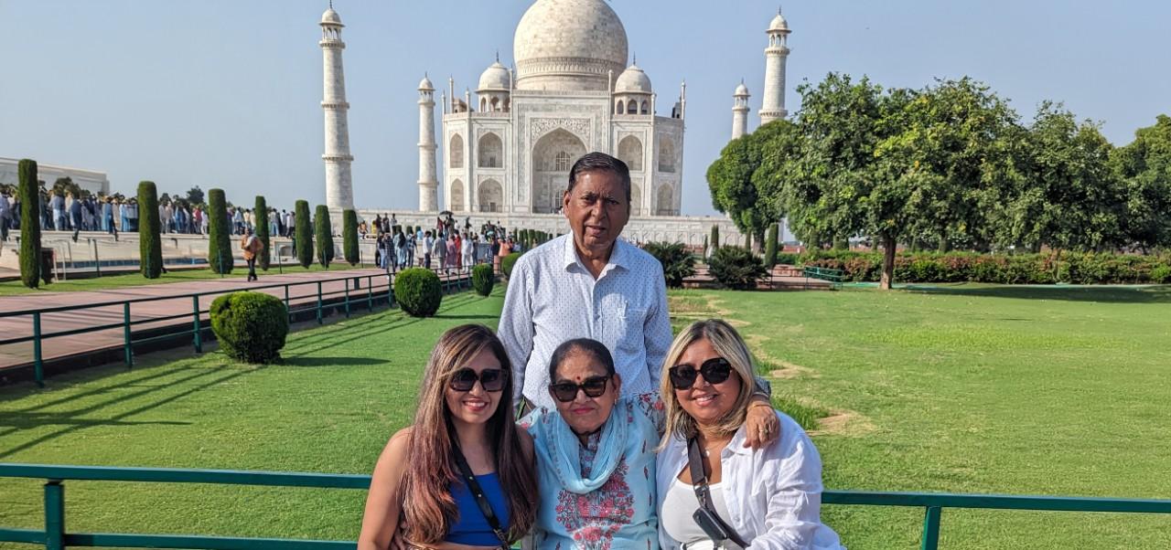 Bhavana Singh, Division of Programs in Business at NYU SPS alumnus, poses for a photo with family at the Taj Mahal.