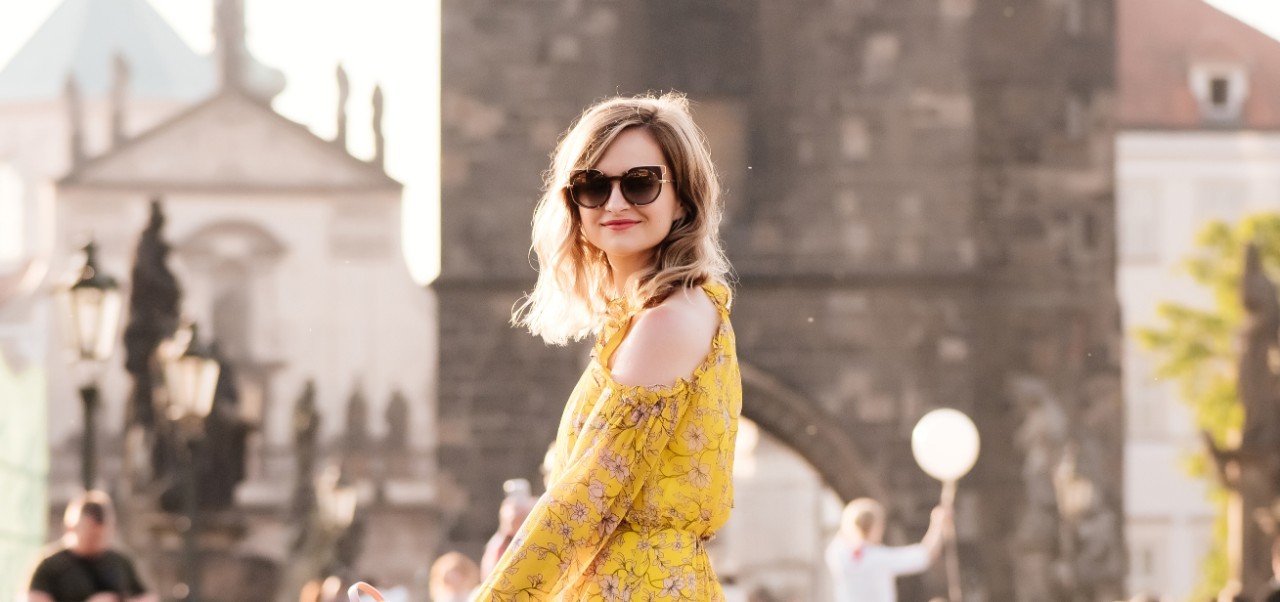 Roksolana Maria Sheverack, NYU SPS Division of Programs in Business alumnus, poses for a picture on the Charles Bridge in Prague.