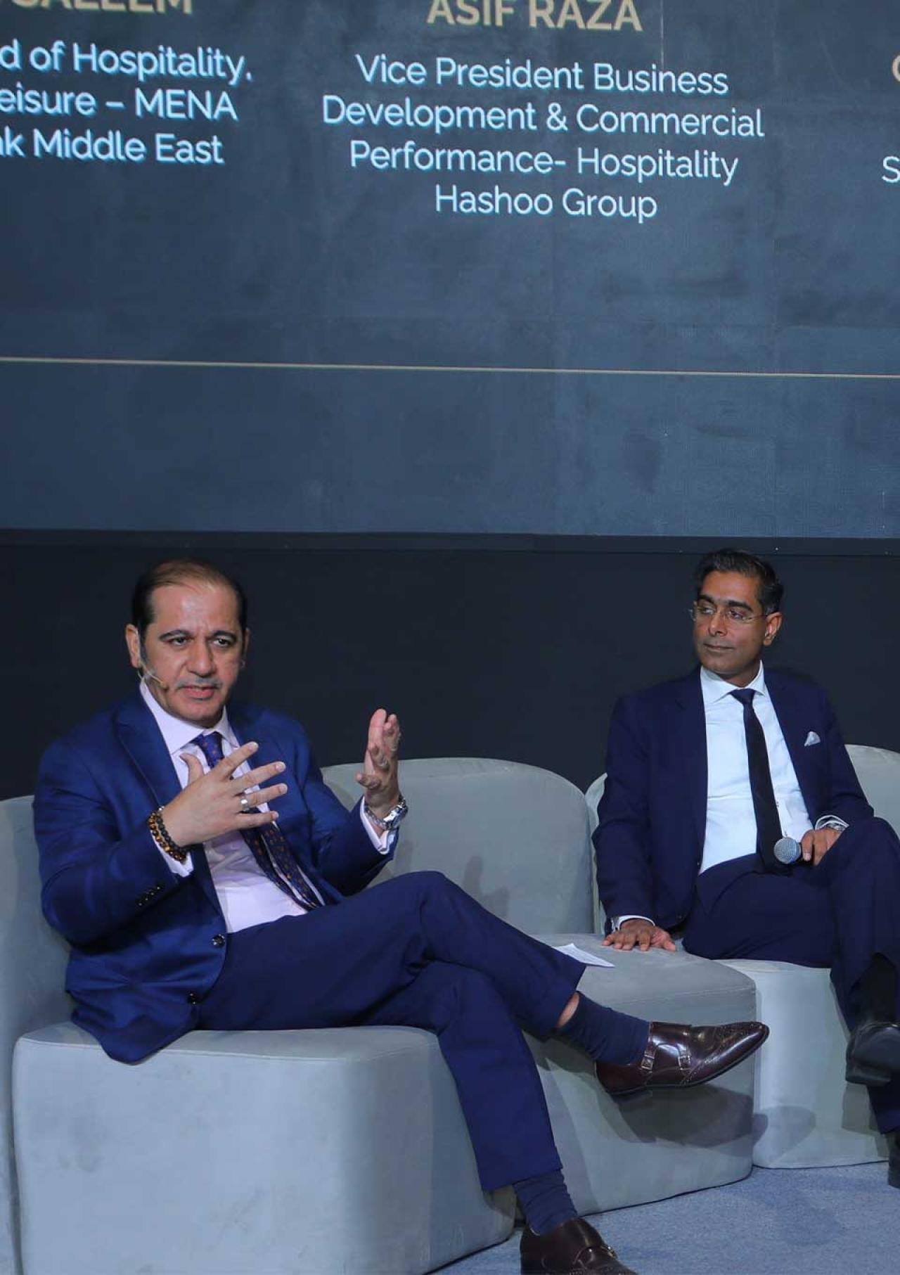 Turab Saleem seated at the Hospitality Leaders Summit, engaged in discussion.