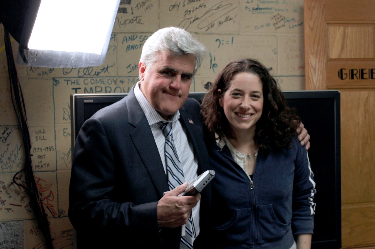 NYU SPS CE instructor Abby Russell smiles for a photo with Jay Leno
