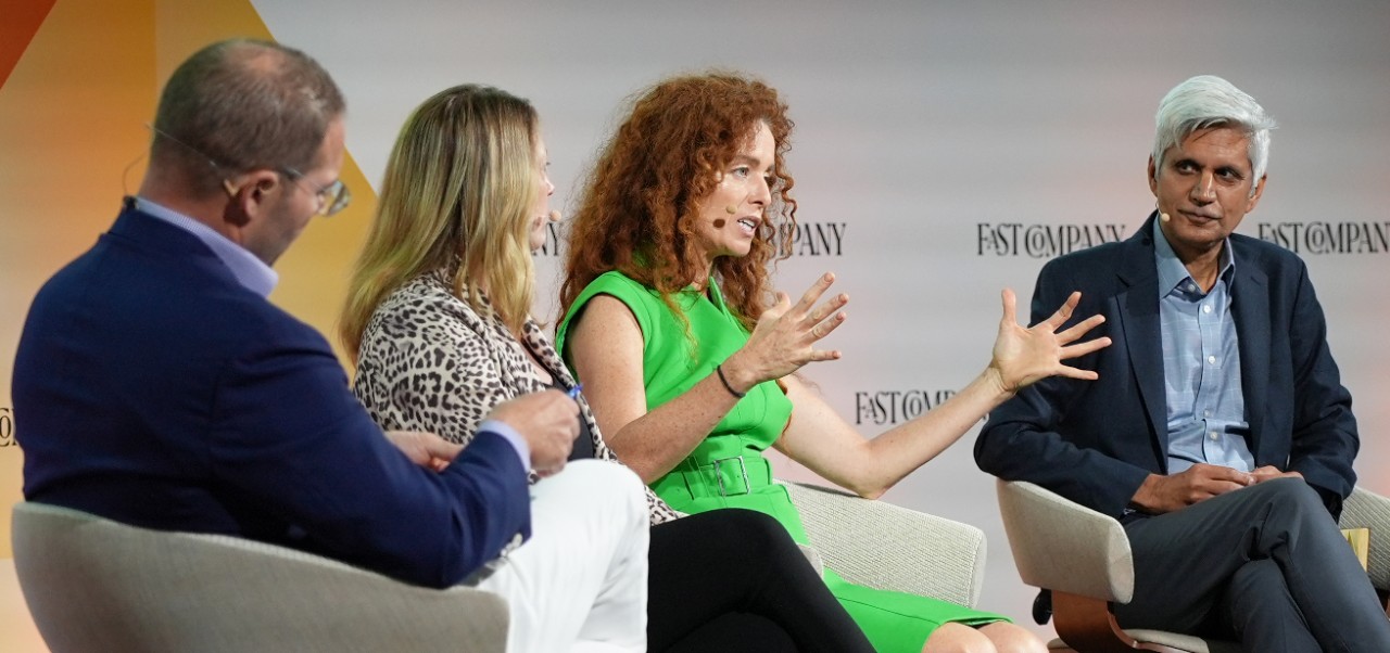 Carolyn Kissane, Clinical Professor, Center for Global Affairs at NYU SPS, participates in a panel discussion with three colleagues at a conference.