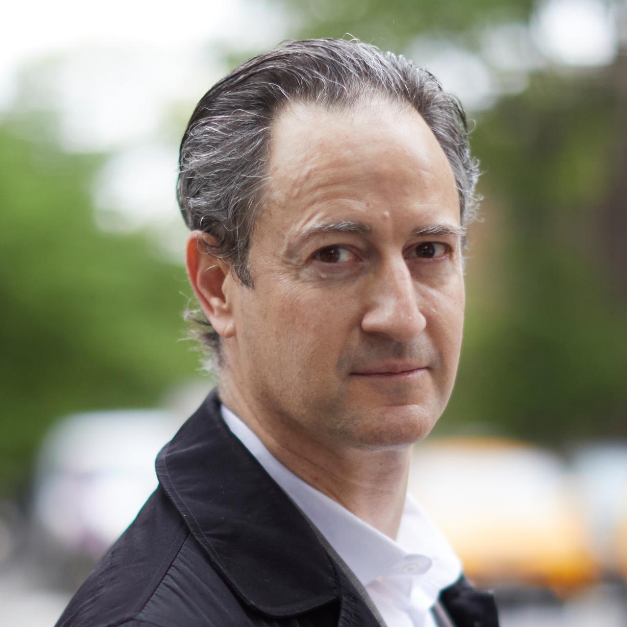 Headshot of Fabio Bertoni with collared shirt and jacket outdoors