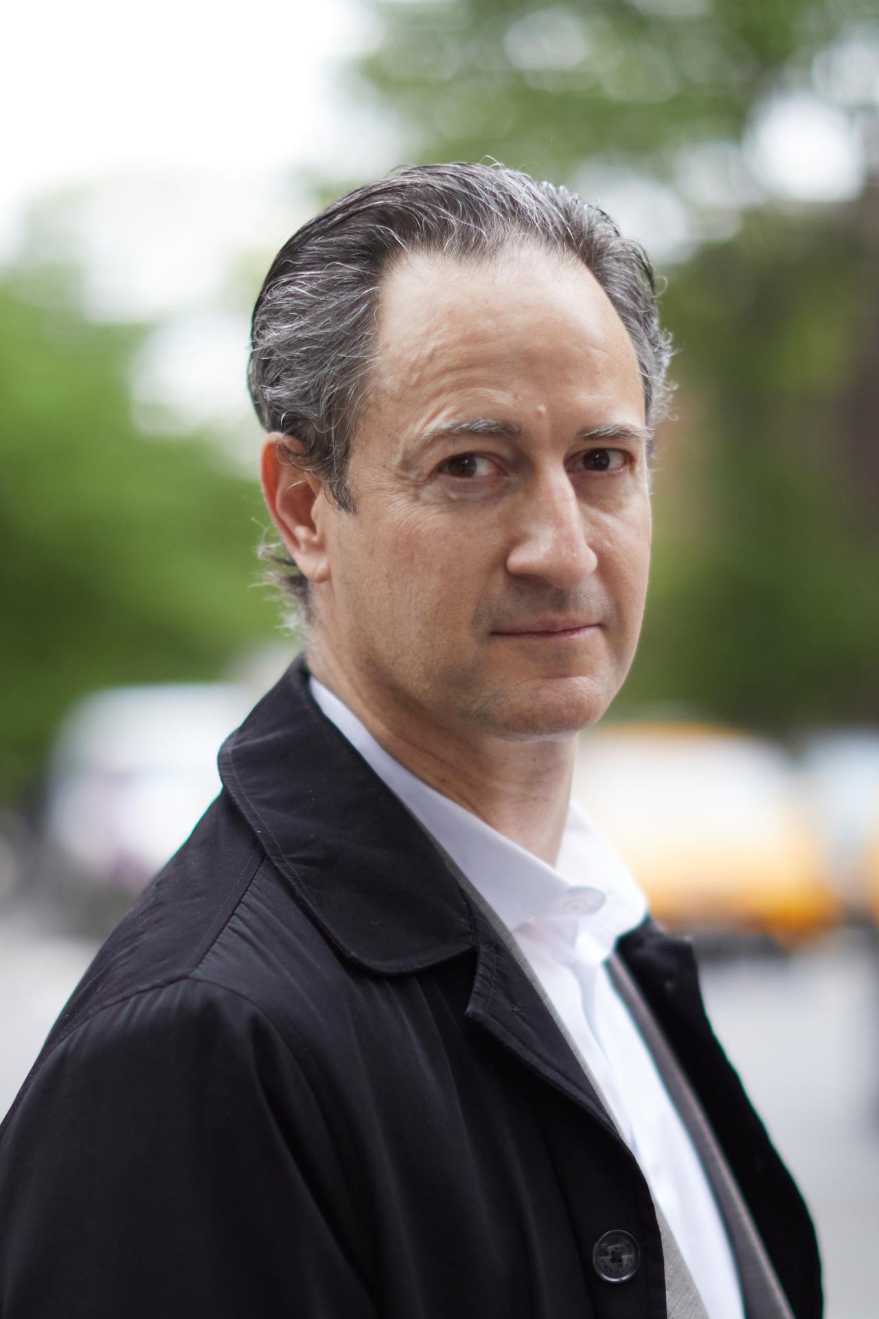 Headshot of Fabio Bertoni with collared shirt and jacket outdoors