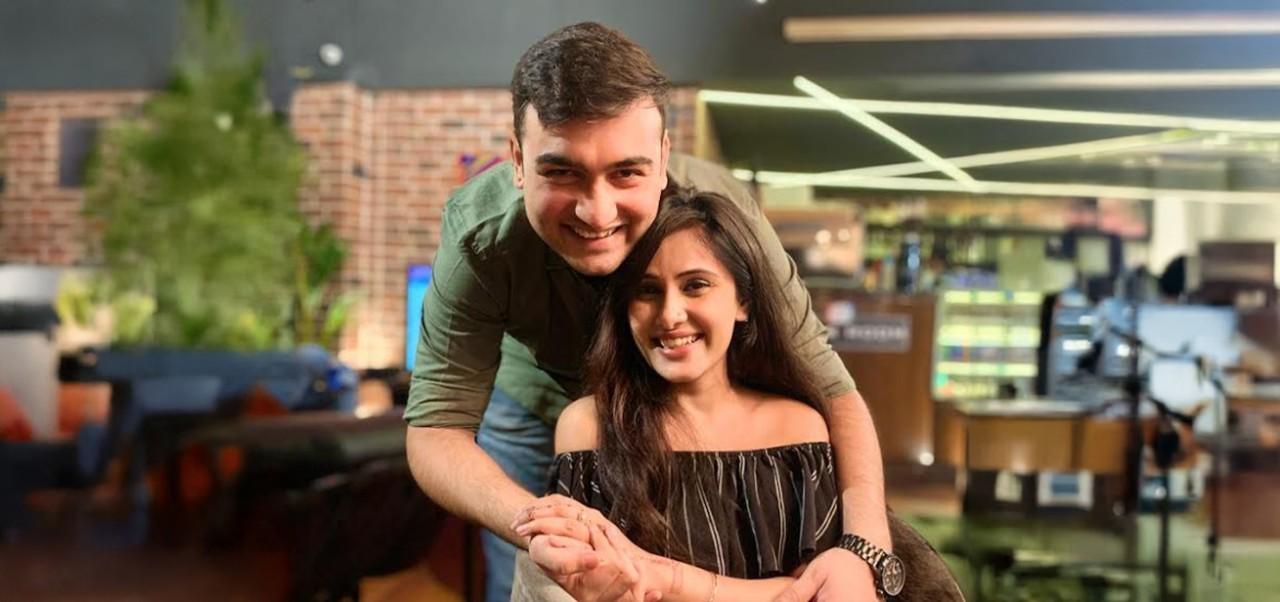 NYU SPS student Chaithanya Bhathi poses for a photo with her husband embracing her