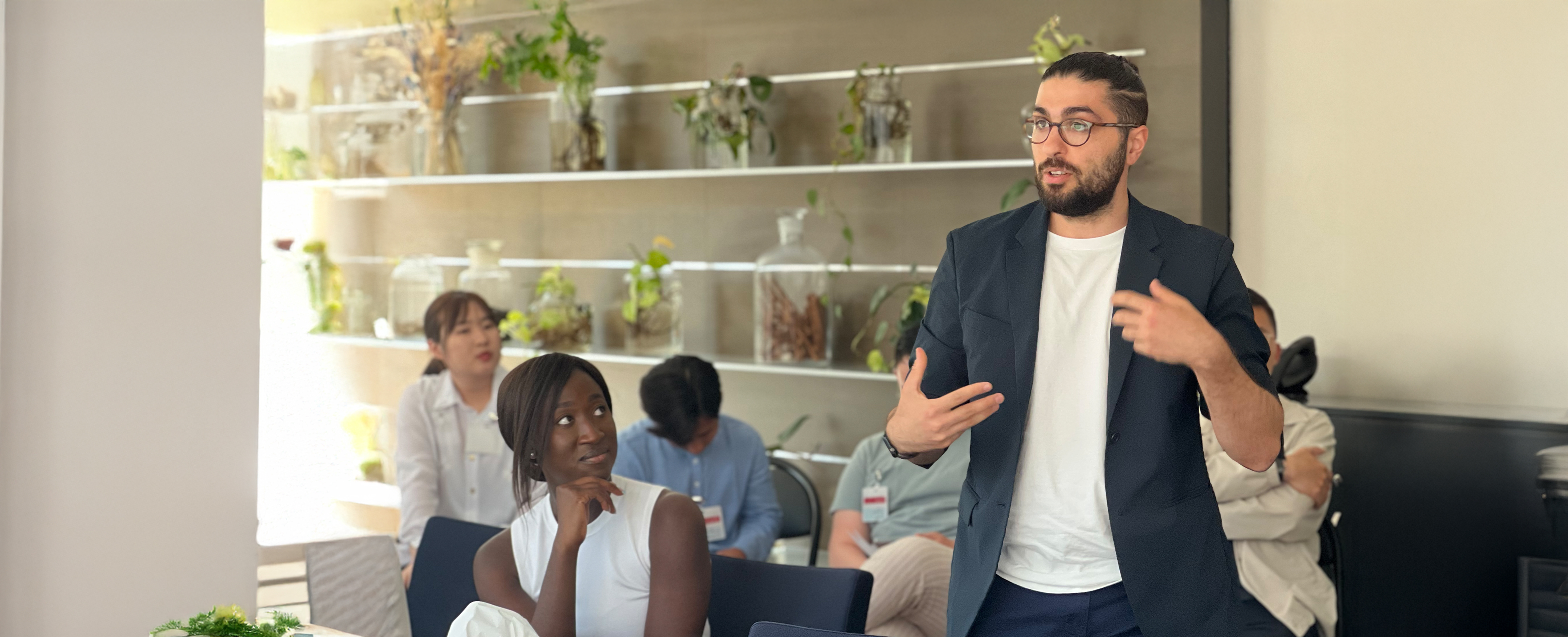 An NYU SPS professor speaks to a room full of students in a Real World class