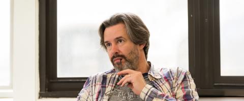 One adult learner listens to a lecture at NYU SPS