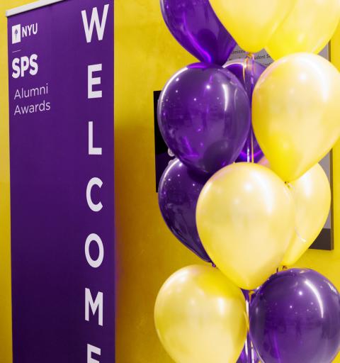 Balloons in front of an SPS welcome banner.