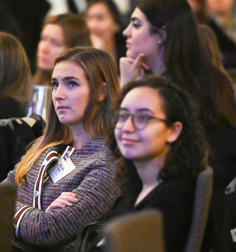 NYU SPS Women in Real Estate Scholarship recipients sit in a busy lecture hall.