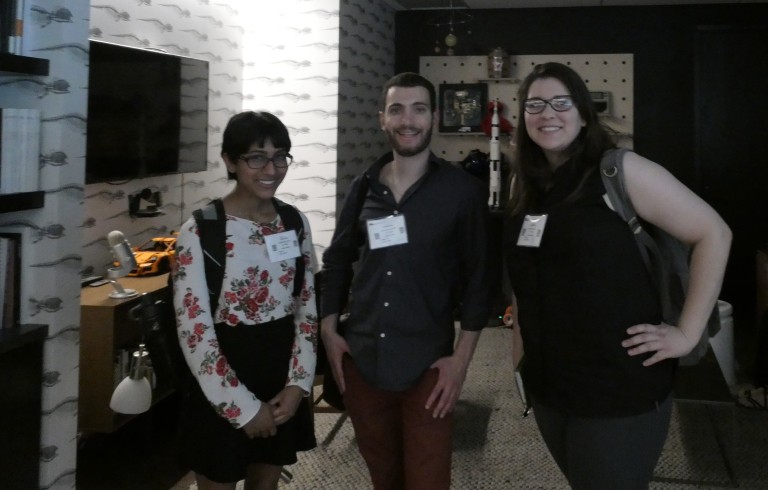 3 students with name tags posing for a photograph