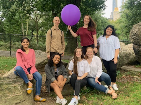 Publishing Students Association (PSA) Officers pictured with a large purple balloon.