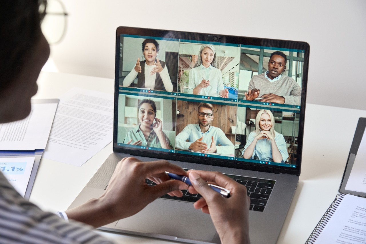 Female Manager Hosting an Online Meeting with Employees