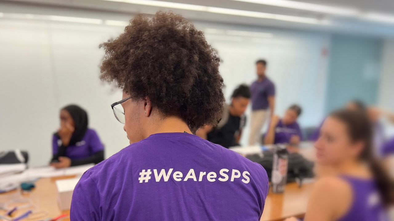 Student with #WeAreSPS purple shirt