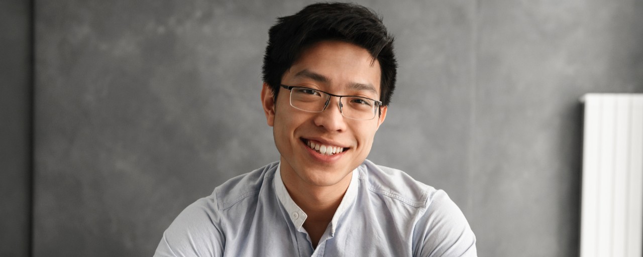 Male asian student with glasses