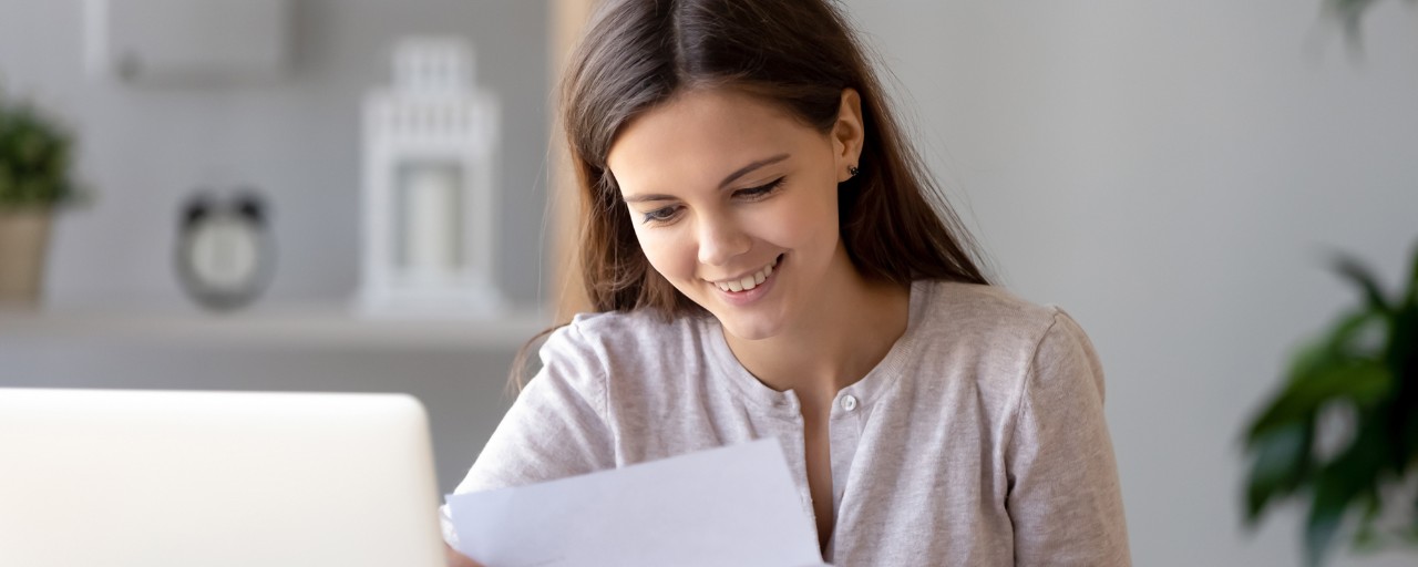 Female student looking at document