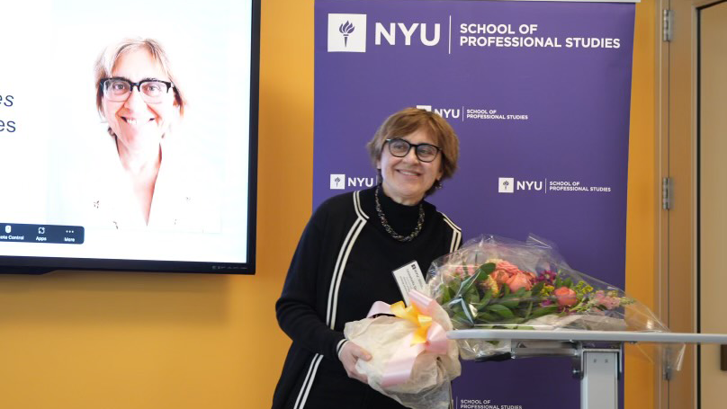 Awardee with flowers bouquet