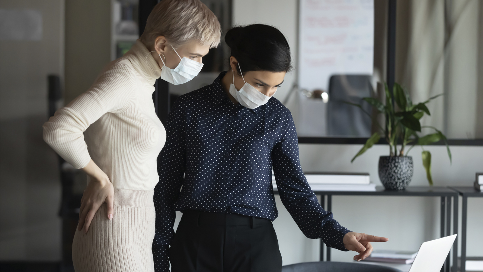 Businesspeople looking at a computer